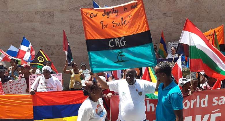 Demonstrators from the Chagos Islands protest for Britain to end its amp;quot;illegal occupationamp;quot;. - Source: Photo by JEAN MARC POCHEAFP via Getty Images