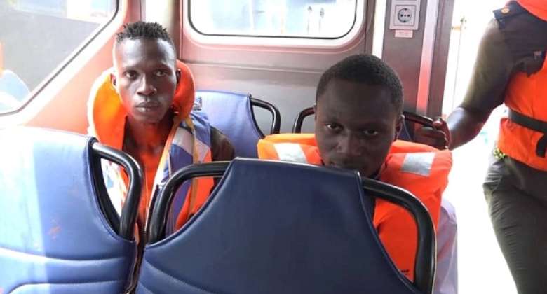 The two suspected stowaways after their arrest