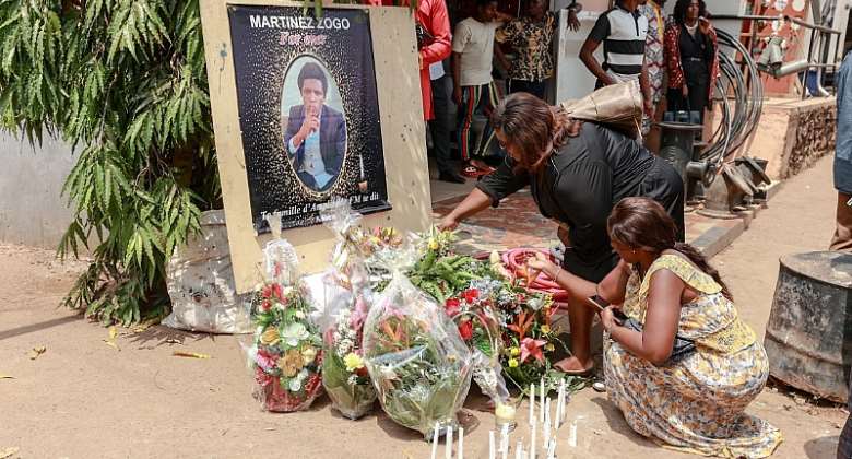 Mourners are seen at a ceremony for killed journalist Martinez Zogo in Yaounde, Cameroon, on January 23, 2023. Police recently arrested new suspects in the investigation into Zogo's death, including businessman Jean-Pierre Amougou Belinga. Daniel Beloumou OlomoAFP