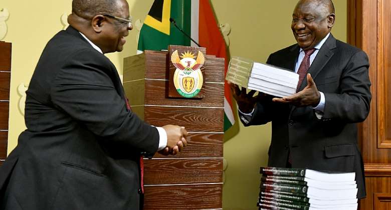 South African President Cyril Ramaphosa receives reports of the of the state capture commission from Justice Raymond Zondo. The reports found exposed massive state corruption involving private individuals and companies.  - Source: GCIS