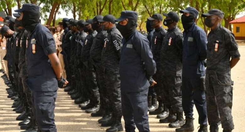 Department of State Security Services stand on guard in Maiduguri, Nigeria on June 17, 2021. Audu MarteAFP