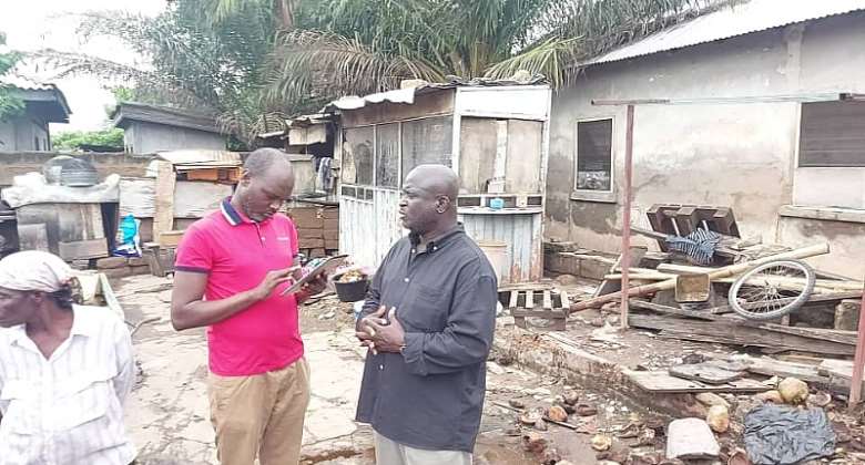 Hon. Adjei Tawiah right interacting with a journalist during the tour