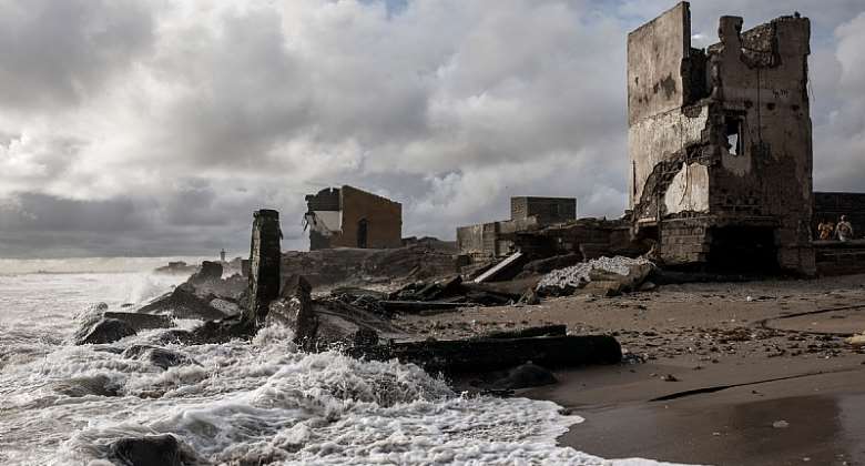 Destroyed buildings along an eroded coastline in Bargny, Senegal. - Source: