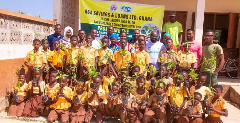 ASA Savings and Loans plants trees at Kintampo Presby Basic School