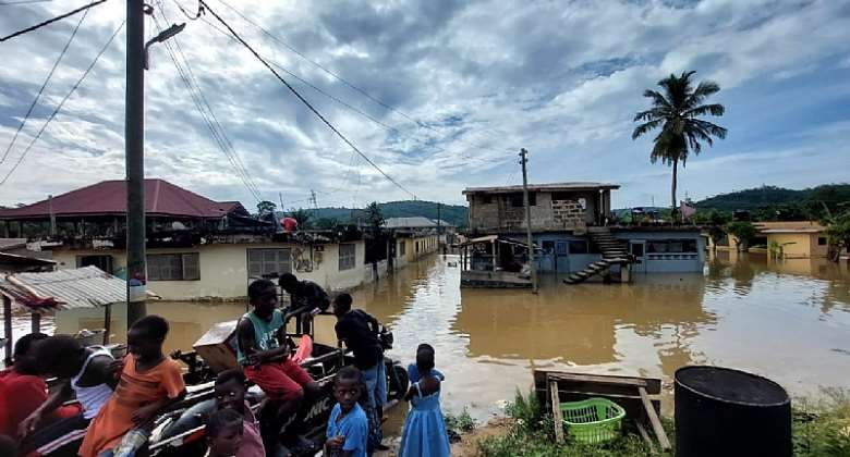 Displaced children seen hanging on aboboyaa as their homes flood.