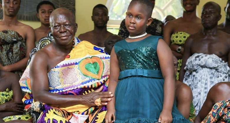 Otumfuo Osei Tutu left and the  young Ghanaian author