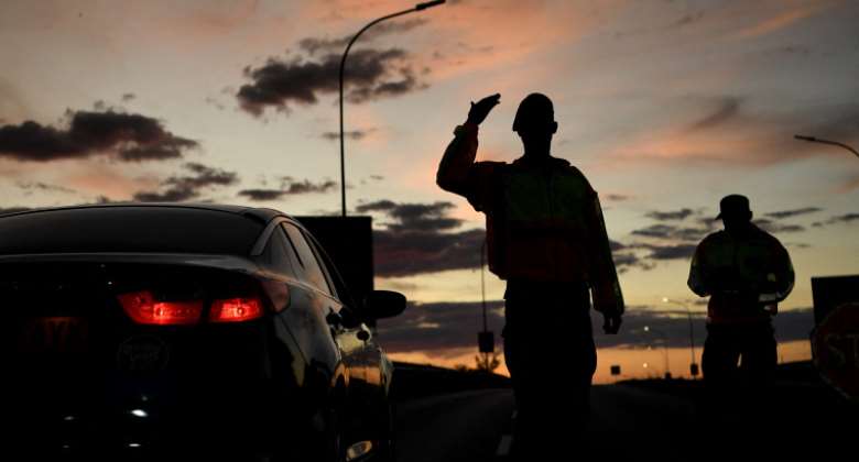 Military police check the travel permits of travelers at a roadblock in Gaborone, Botswana on April 5, 2020. Police in Botswana charged staff members at Moeladilotlhoko News Boiler with criminal trespass. AFPMonirul Bhuiyan