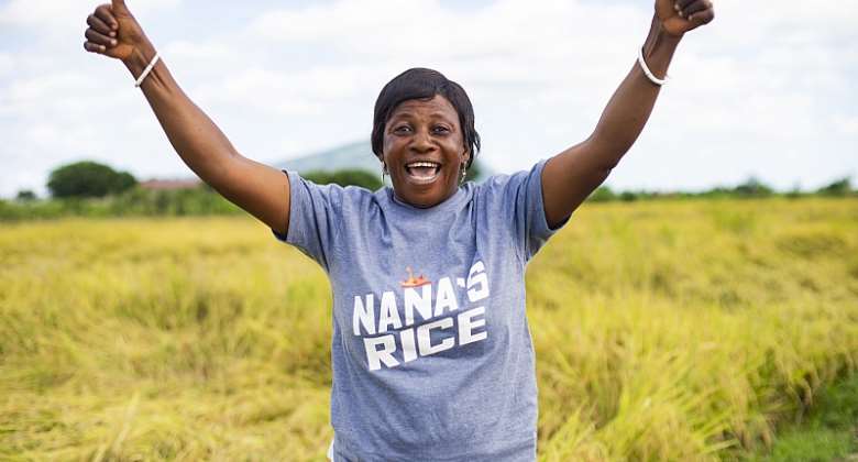 Meet Madam Regina, a happy rice farmer