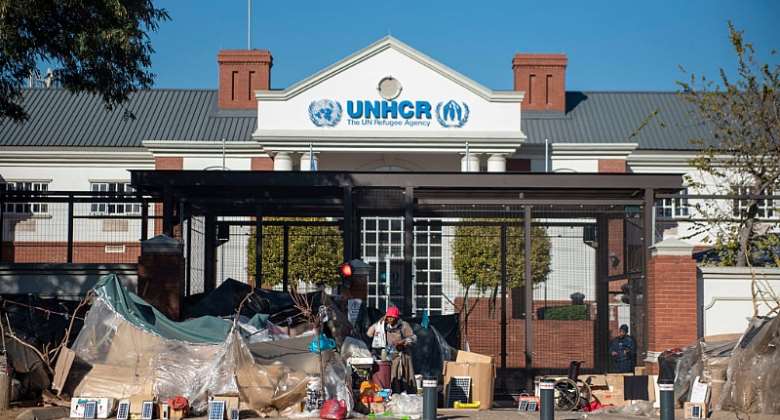 Refugees take shelter in front of the UN refugee centre in South Africa.  - Source: Ihsaan HaffejeeAnadolu Agency via Getty Images
