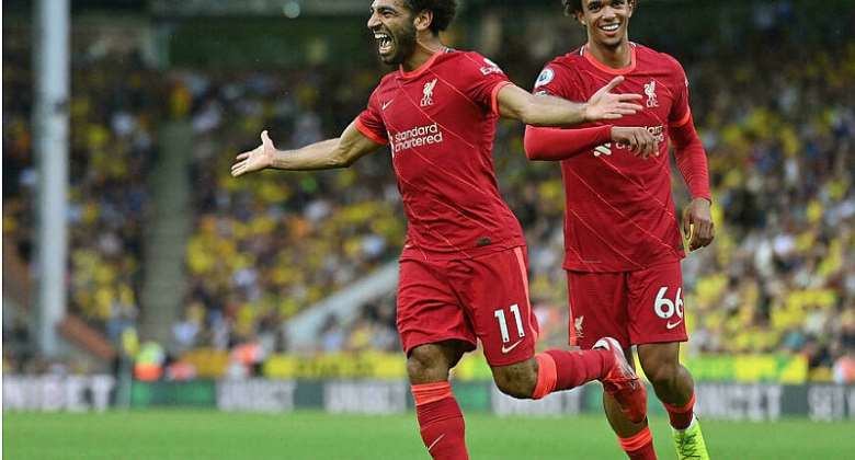 Mohamed Saleh (L) celebrates his goal for Liverpool at Norwich on the opening weekend of the English Premier League season JUSTIN TALLIS AFP
