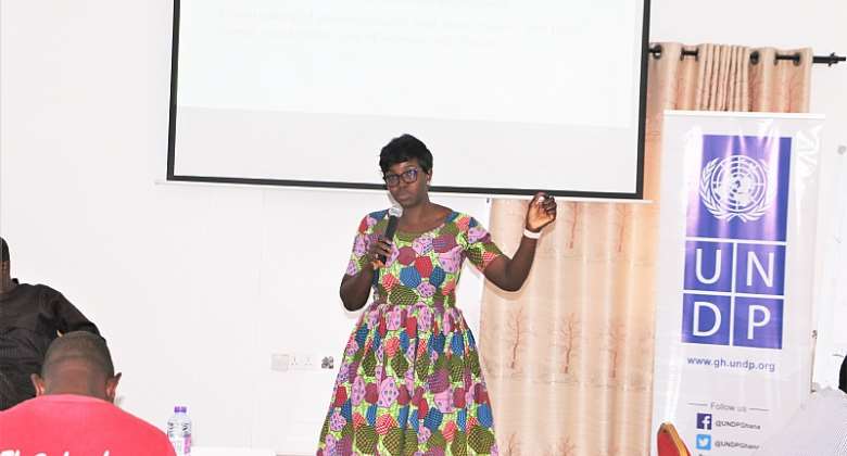 UNDP Peace Analyst, Melody Azinim making a presentation on PVE