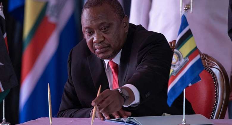 President Uhuru Kenyatta signs a treaty integrating DRC into the East African Community in June 2022.  - Source: Tony KarumbaAFP via Getty Images