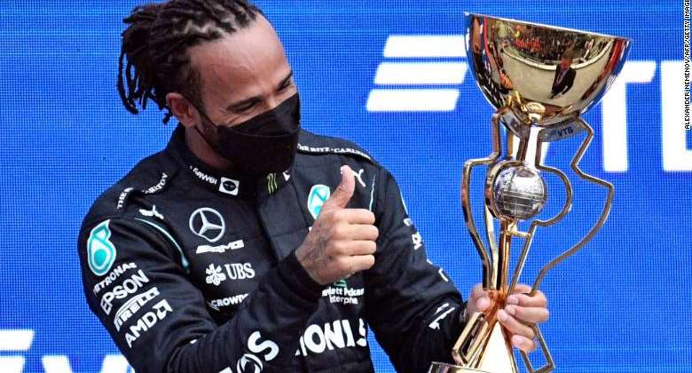Hamilton celebrates on the podium after winning the Russian Grand Prix