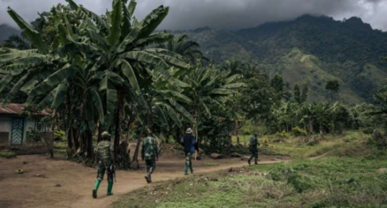 A Congolese army patrol pictured in May in the mountainous Rwenzori sector near the Ugandan border, which has suffered many ADF attacks.  By ALEXIS HUGUET AFP