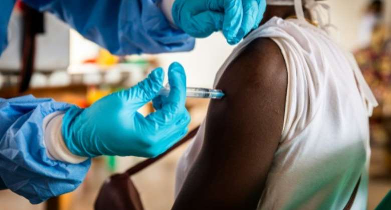 A Covid vaccine shot is administered in Bimbo, Central African Republic, where just seven percent of the population is inoculated.  By Barbara DEBOUT AFP