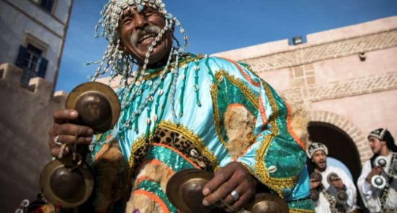A Gnawa traditional group performs in the city of Essaouira to celebrate the decision of adding the Gnawa culture to UNESCO's list of Intangible Cultural Heritage of Humanity.  By FADEL SENNA (AFP)
