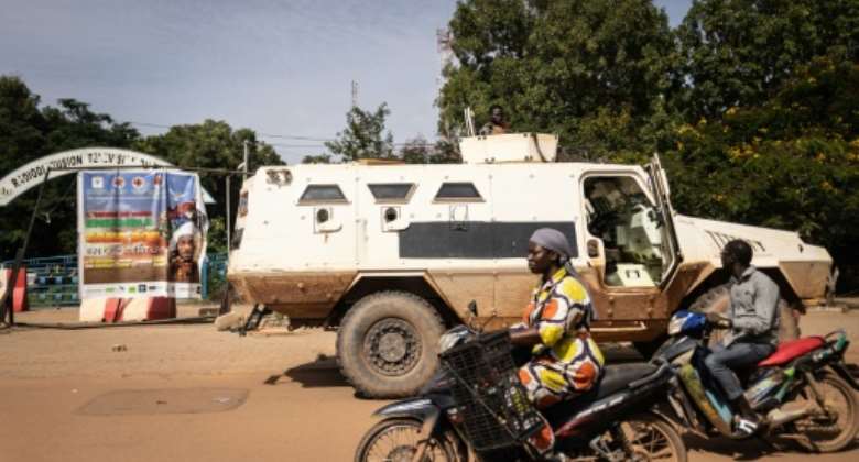 A military vehicle sits outside the Burkina Faso national television offices in Ouagadougou on Saturday.  By OLYMPIA DE MAISMONT AFP