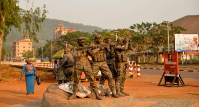 A monument near the University of Bangui pays tribute to Russian private security operators and fighters who 'died for the liberation' of the CAR. It depicts four armed men protecting a mother and her children.  By Barbara DEBOUT AFP