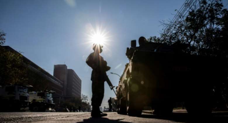 A soldier stands guard outside the High Court in Pietermaritzburg.  By GUILLEM SARTORIO AFP