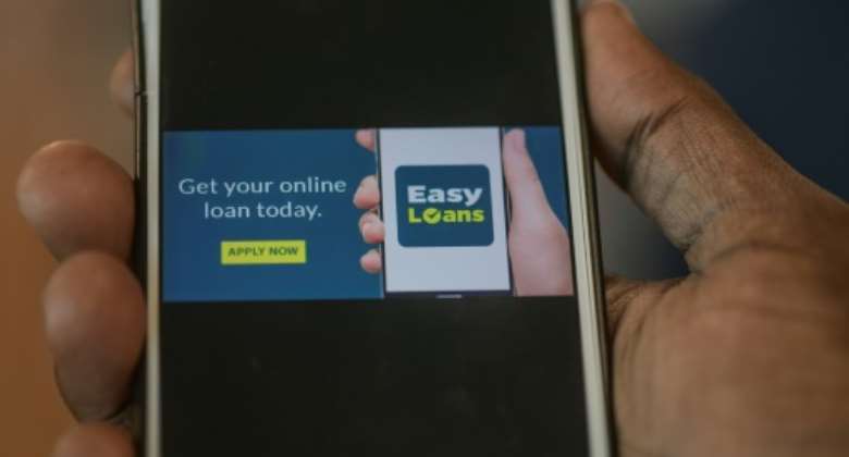 A surge in digital lending has seen thousands of Kenyans swipe their way into debt.  By Simon MAINA (AFP)