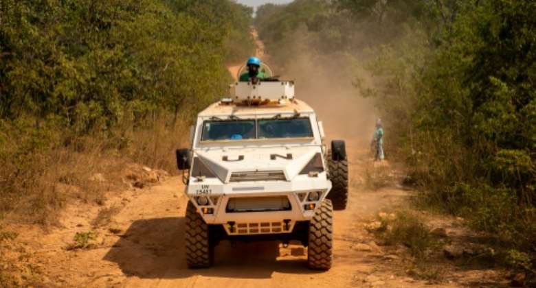 A UN armoured personnel carrier patrols a road in Paoua, Central African Republic on December 5, 2021.  By Barbara DEBOUT AFPFile