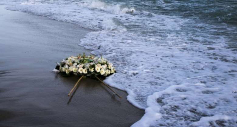 A wreath floats on the Mediterranean at the site of a deadly migrant shipwreck off Italy.  By Gianluca CHININEA AFP