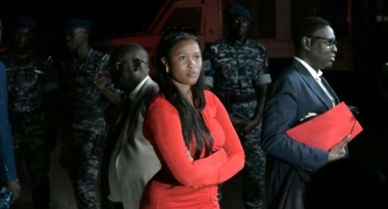 Adji Sarr, 23, says opposition leader Ousmane Sonko raped her and made death threats.  By SEYLLOU AFP
