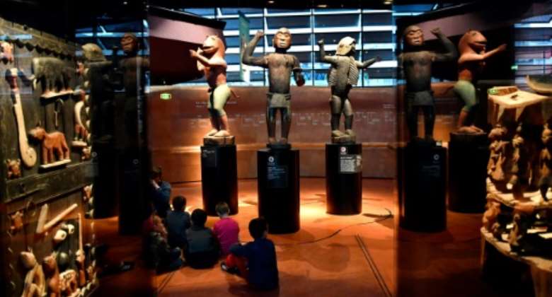 African statues, plundered by French troops in 1892 from the kingdom of Dahomey -- modern-day Benin -- are displayed in Paris' Quai Branly museum.  By GERARD JULIEN AFP