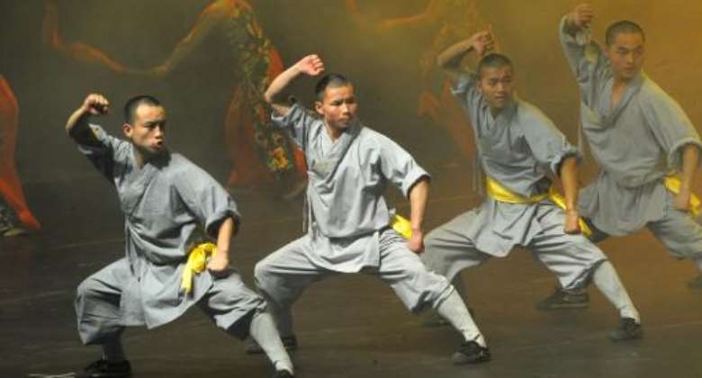 Buddhist monks from China's Shaolin Temple perform at Dakar's Grand Theatre on January 19, 2014.  By Seyllou AFPFile