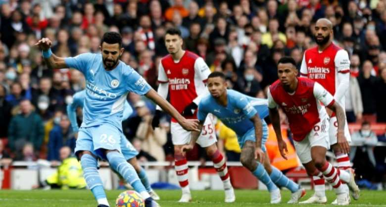 Algeria captain Riyad Mahrez (L) converts a penalty for Manchester City against Arsenal in the Premier League last weekend..  By Ian KINGTON (IKIMAGES/AFP)