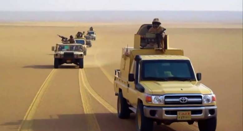 An image grab taken from a handout video released by the official Facebook page of Egypt's Military Spokesman on December 8, 2020 shows an Egyptian army trucks in the desert.  By - EGYPTIAN DEFENCE MINISTRYAFP