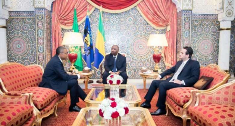 Brice Laccruche (R) became a powerbroker in Gabon after President Ali Bongo (C) suffered a stroke in 2018.  By - (GABONESE PRESIDENCY/AFP/File)