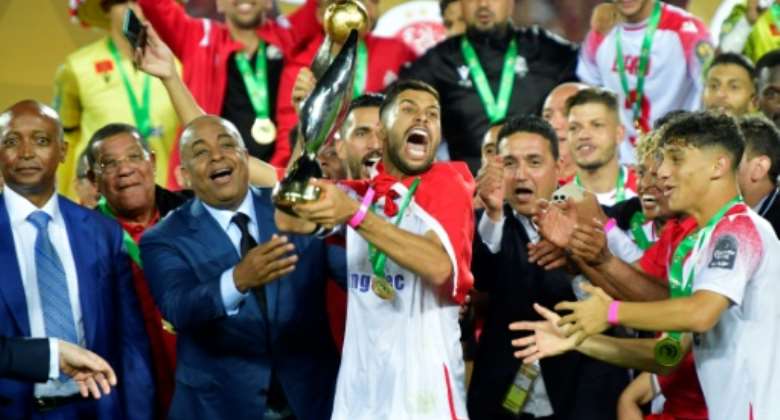 Captain Yahya Jabrane C lifts the trophy after Wydad Casablanca defeated Egyptian club Al Ahly in the CAF Champions League final on May 30, 2022..  By - AFP