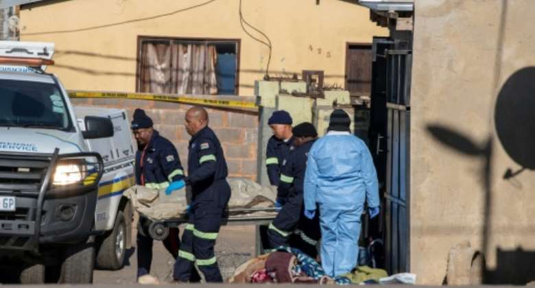 Crime wave: 14 people were killed in a shootout in a Soweto bar in July.  By Ihsaan HAFFEJEE AFP