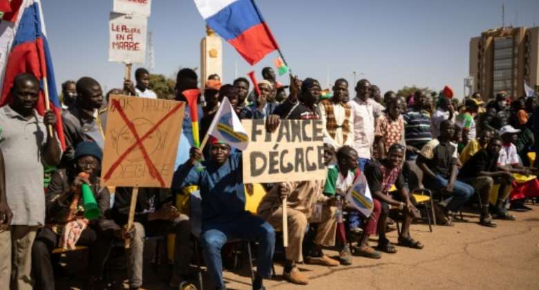 Demonstrators waving Russian flags staged a rally in Ouagadougou in January to demand France pull out its ambassador and withdraw its troops.  By OLYMPIA DE MAISMONT AFP
