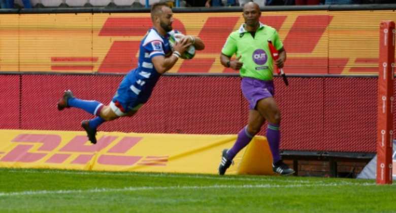 Dewaldt Duvenage scores a Super Rugby try for the Stormers before joining Italian club Benetton three years ago..  By ANDER GILLENEA AFP