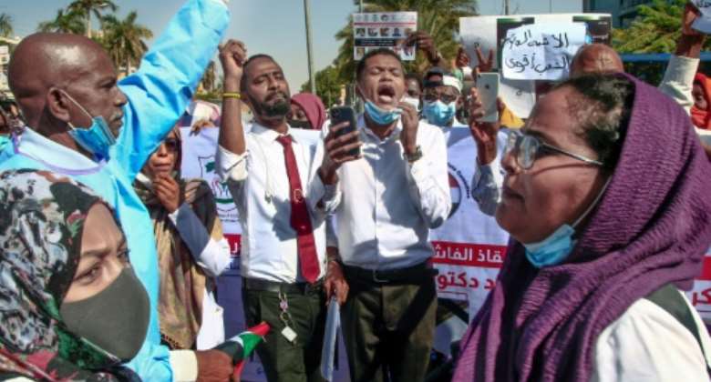 Dozens of Sudanese doctors demonstrate in Khartoum on January 16, 2022 to denounce attacks by security forces against medical personnel and doctors during pro-democracy rallies opposed to the October military coup.  By - AFPFile