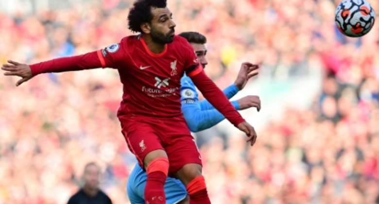 Egypt star Mohamed Salah L wins a heading duel during the Premier League draw between Liverpool and Manchester City at the weekend..  By Paul ELLIS AFP