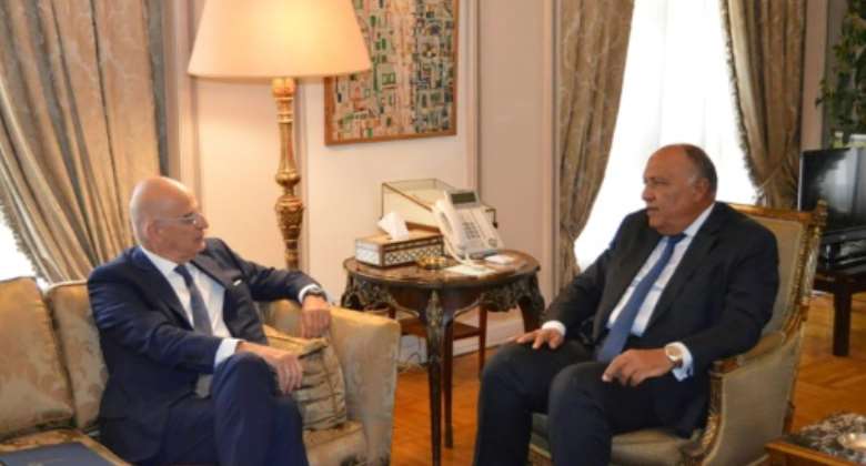 Egyptian Foreign Minister Sameh Shoukry R met with his Greek counterpart Nikos Dendias in Cairo on Sunday, discussing events in neighbouring Libya.  By - EGYPTIAN FOREIGN MINISTRY SPOKESPERSONAFP
