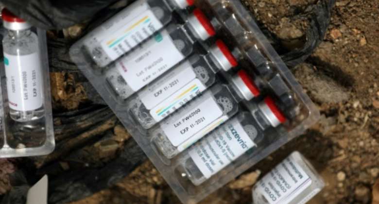Expired AstraZeneca vaccine doses at a dump in Abuja, Nigeria last month.  By Kola Sulaimon (AFP)