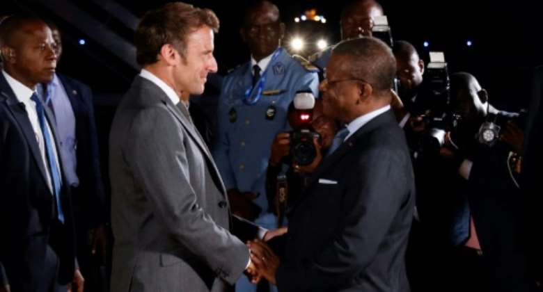 French President Emmanuel Macron is welcomed by Cameroon's Prime Minister Joseph Dion Ngute at the start of his three-nation tour of western Africa.  By Ludovic MARIN AFP