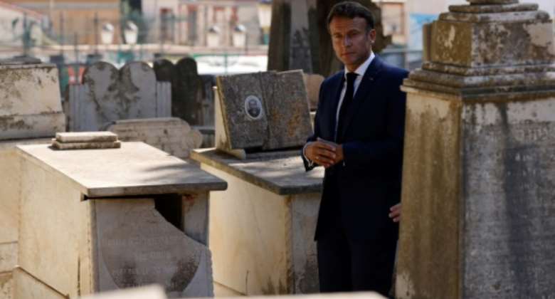 French President Emmanuel Macron visits the European Saint-Eugene Cemetery in Algiers on August 26, 2022, the second day of his visit to the former colony.  By Ludovic MARIN AFP