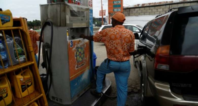 Fuel shock: The price of petrol in Nigeria has risen by around 15 percent after the government curbed subsidies.  By PIUS UTOMI EKPEI AFP