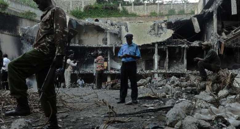 A soldier stands guard on January 21, 2014 at the destroyed Westgate mall in Nairobi.  By Tony Karumba AFPFile
