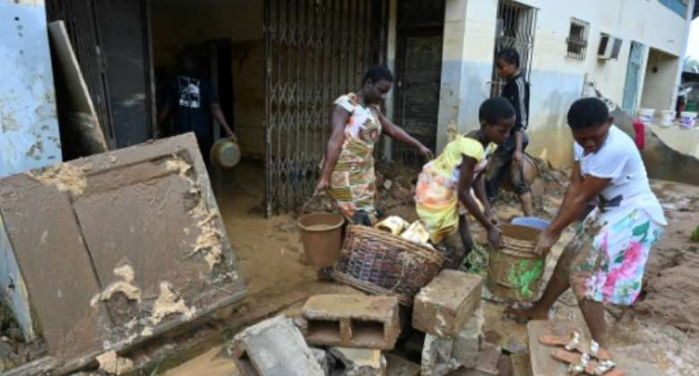 In Bingerville, residents cleared out their homes after the water finally receded.  By Issouf SANOGO AFP