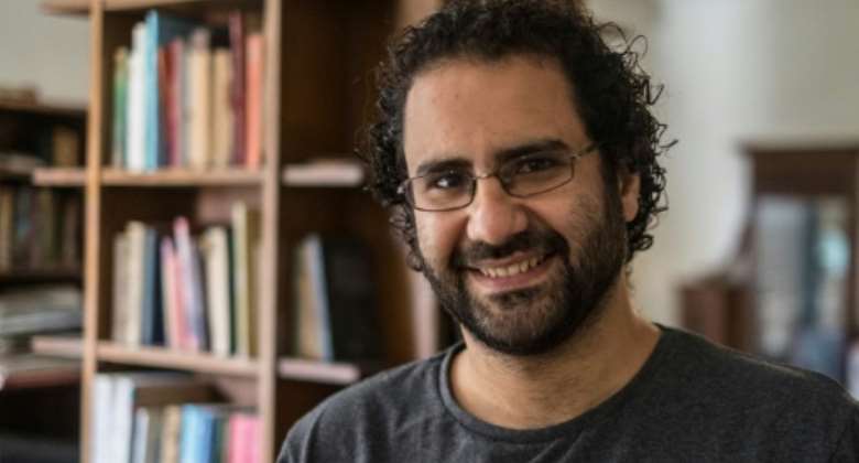In this file photo taken on May 17, 2019, Egyptian activist and blogger Alaa Abdel Fattah gives an interview at his home in Cairo.  By Khaled DESOUKI, Khaled DESOUKI AFPFile
