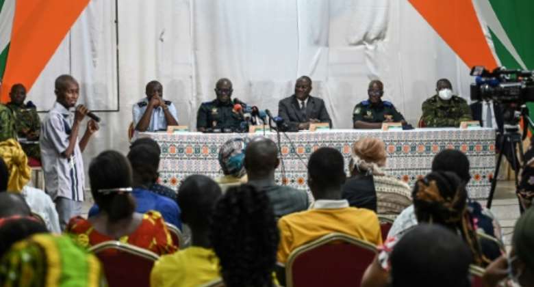 Ivory Coast's defence minister, chief of staff and generals speaking on August 3 to relatives of the 49 soldiers detained in Mali.  By Sia KAMBOU AFPFile