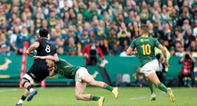 Jesse Kriel made an early tackle on All Black Ardie Savea but then went off injured forcing a Springbok reshuffle.  By PHILL MAGAKOE AFP