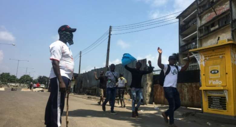 Makeshift barricades emerged in Lagos run by men in civilian clothes carrying machetes and sticks who present themselves as policemen.  By Sophie Bouillon AFP