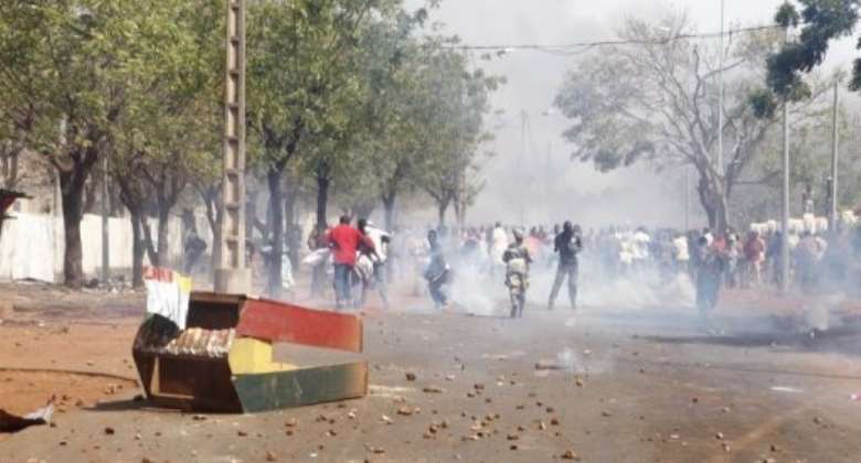 Supporters of Malian soldiers fighting Tuareg rebels, clash with security forces during a protest.  By  (AFP/File)